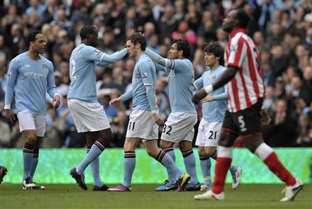 Manchester City's Carlos Tevez, Centre Right, Reacts