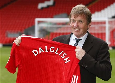 Liverpool''s New Manager Kenny
            Dalglish Poses For The Media In Front Of The Kop At Anfield Stadium In
            Liverpool, England,