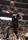Miami Heat small forward LeBron James (6) goes for a dunk during the first half of an NBA basketball game against the Dallas Mavericks in Dallas on Saturday, Nov. 27, 2010.