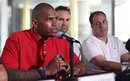 Former Ohio State football player Terrelle Pryor, left, as members of his agent Drew Rosenhaus' staff look oon during a news conference Tuesday, June 14, 2011 in Miami Beach, Fla. Speaking out for the first time since his college career at Ohio State ended embroiled in scandal, Prior apologized to the Buckeyes, to his former teammates and to now-departed coach Jim Tressel for his role in the mess that may take down one of America's proudest programs.
