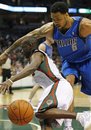 Milwaukee Bucks ' Earl Boykins drives to the basket as Dallas Mavericks ' Tyson Chandler (6) defends in the second half of an NBA basketball game Saturday, Jan, 1, 2011, in Milwaukee.