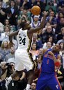 Utah Jazz forward Paul Millsap (24) and Detroit Pistons guard Tracy McGrady (1) watch the ball get away during the first half of an NBA basketball game in Salt Lake City, Monday, Jan. 3, 2011.