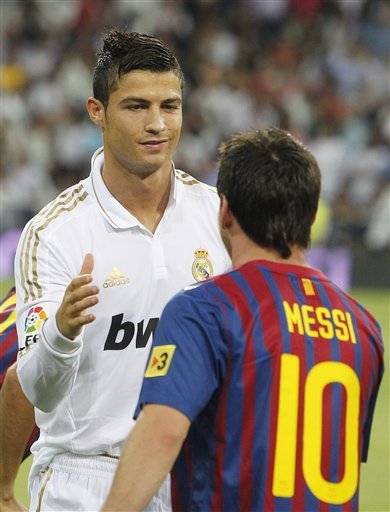 FC Barcelona's Lionel Messi From Argentina, Right, Shakes Hands With Real Madrid's Cristiano Ronaldo From Portugal,