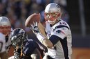 New England Patriots quarterback Tom Brady (12) looks to throw against the Denver Broncos in the first quarter of an NFL football game, Sunday, Dec. 18, 2011, in Denver.