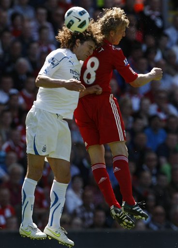 Liverpool's Dirk Kuyt, Right, Vies