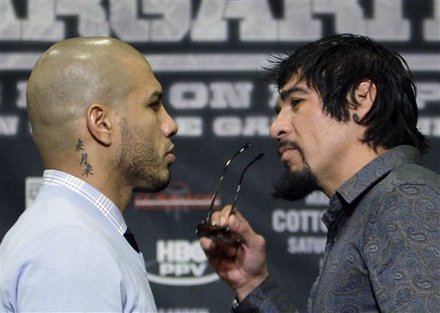 Miguel Cotto, Left, Of Puerto Rico, And Antonio Margarito, Of Mexico, Face Off While Promoting Their Dec. 3 Bout In New