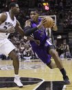 Sacramento Kings ' Jason Thompson , right, drives past San Antonio Spurs ' Antonio McDyess (34) during the fourth quarter of an NBA basketball game on Wednesday, April 6, 2011, in San Antonio.