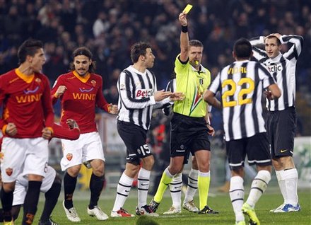 Referee Daniele Di Schio, Third From Right, Gives Juventus' Arturo Vidal, Second From Right, Of Chile, A Yellow Card