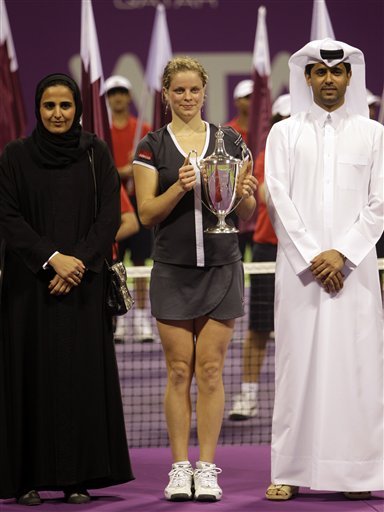 Belgium's Kim Clijsters, Middle, Poses With Sheikha Alayassa Bint Hamad Bin Khalifa Al Thani, Daughter Of Emir Of Qatar,