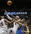 Atlanta Hawks power forward Josh Smith (5) battles for a rebound with teammate Al Horford (15) against Dallas Mavericks power forward Dirk Nowitzki , right, of Germany, during the second quarter of an NBA basketball game Saturday, Nov. 20, 2010 in Atlanta.