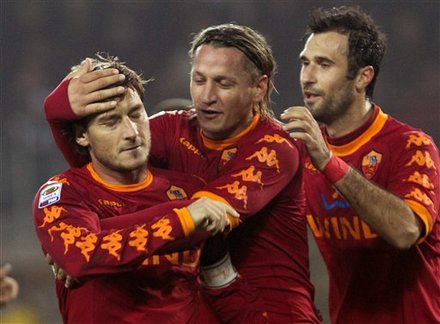 As Roma Captain Francesco Totti, Left, Celebrates With Teammates Philippe Mex