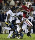 Stanford running back Stepfan Taylor (33) is brought down by California defensive back D.J. Campbell (7)  during the first quarter of an NCAA college football game in Stanford, Calif., Saturday, Nov. 19, 2011.