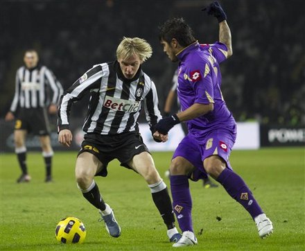 Juventus'  Milos Krasic Of Serbia, Left, Fights