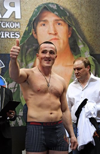 Russia's Denis Lebedev gestures during the weigh-in event in Moscow, Russia, Friday, May 20, 2011, ahead of a light heavyweight fight against Roy Jones Jr of the United States on Saturday night in Megasport Arena in Moscow.