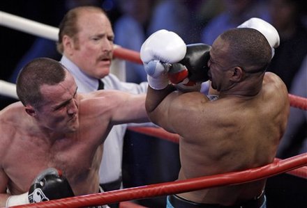 Russia's Denis Lebedev, Left, And Roy Jones Jr. Of The US In Action