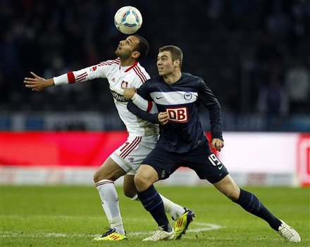 Berlin's Pierre-Michel Lasogga, Right, And Leverkusen's Oemer Toprak, Left, Challenge For The Ball