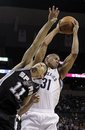 Memphis Grizzlies forward Shane Battier (31) takes a rebound away from San Antonio Spurs guard Chris Quinn (11) during the second half of an NBA basketball game in Memphis, Tenn., Tuesday, March 1, 2011. Memphis won 109-93.