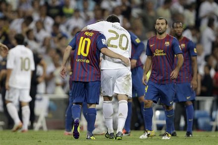 FC Barcelona's Lionel Messi, Left And Gonzalo Higuain, Both From Argentina Hug At The End Of The First Leg Of The