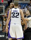 Referee Eli Roe, right, separates the Los Angeles Lakers ' Kobe Bryant , left, and the Sacramento Kings ' Francisco Garcia , center, after Garcia fouled Bryant late in the  second half in Sacramento, Calif. on Wednesday Nov. 3, 2010   The Lakers beat the Kings 112-110.