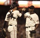 San Francisco Giants ' Santiago Casilla , right, and catcher Chris Stewart celebrate the Giants 2-1 win over the San Diego Padres at the end of a baseball game Wednesday, Aug. 24, 2011, in San Francisco.