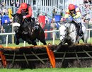 Big Bucks ridden by Ruby Walsh, left, leads Grand Crus ridden by Tom Scudamore over the last hurdle to win the Liverpool Hurdle race at Aintree racecourse, Liverpool England Thursday April 7, 2011. Grand Crus finished the race in second place (AP Photo/John Giles/PA) UNITED KINGDOM OUT NO SALES NO ARCHIVE