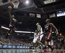 Miami Heat 's Dwyane Wade (3) goes up for a shot during the first half of an NBA basketball game against the Milwaukee Bucks Monday, Dec. 6, 2010, in Milwaukee.