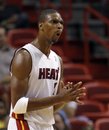Miami Heat 's Chris Bosh reacts to a call by one of the officials in the NBA basketball game against the Toronto Raptors in the first  quarter of  in Miami, Saturday, Nov. 13, 2010.