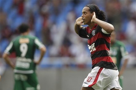 Flamengo's Ronaldinho, celebrates after scoring against Boavista during a Guanabara Cup final game in Rio de Janeiro, Brazil, Sunday, Feb. 27, 2011. The Guanabara Cup is the first stage of the Rio tournament, and its winner will play for the Rio state title against the Rio Cup champion.