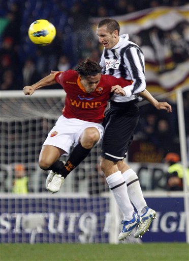 AS Roma's Rodrigo Taddei Of Brazil, Left, And Juventus' Giorgio Chiellini Jump For The Ball