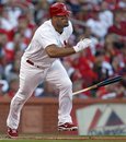St. Louis Cardinals ' Albert Pujols drops his bat on a double during the first inning of Game 3 of baseball's National League division series against the Philadelphia Phillies on Tuesday, Oct. 4, 2011, in St. Louis. The Phillies won 3-2.