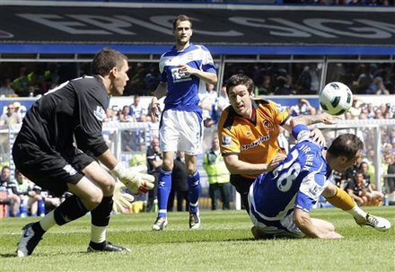 Birmingham City's Martin Jiranek, Right, Roger Johnson, Second Left, And Ben Foster, Left, Compete For The Ball With