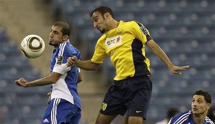 Saudi's Al-Hilal Player Abdulatif Al-Ghanam, Left, Vies For The Ball Against Saudi's Al Nasr Player Mohamad Al-Harthi