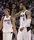 Dallas Mavericks ' Tyson Chandler (6) celebrates as he and Dirk Nowitzki (41) of Germany, walk off the court following their NBA playoff basketball game  against the Portland Trail Blazers Saturday, April 16, 2011, in Dallas. The Mavericks won 89-81.