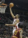 Portland Trail Blazers ' Marcus Camby , left, lays the ball up as Cleveland Cavaliers ' Alonzo Gee (33) looks on in the second half during their NBA basketball game Thursday, March 17, 2011, in Portland, Ore. The Trail Blazers defeated the Cavaliers 111-70.(AP Photo)