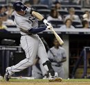 Tampa Bay Rays ' Evan Longoria hits a home run during the eighth inning of a baseball game against the New York Yankees , Friday, Aug. 12, 2011, at Yankee Stadium in New York. The Rays won the game 5-1.
