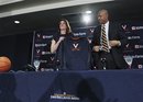 In a photo provided by the University of Virginia , Virginia's new women's basketball coach Joanne Boyle stands next to Virginia athletic director Craig Littlepage on Monday, April 11, 2011, in Charlottesville, Va. Boyle agreed to a five-year contract that will pay her $700,000 a season. She also gets a $125,000 signing bonus and another $125,000 if she stays all five years.