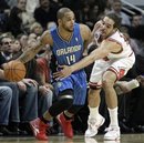 Orlando Magic 's Jameer Nelson , left, looks to a pass against Chicago Bulls ' Joakim Noah during the third quarter of an NBA basketball game in Chicago, Wednesday, Dec. 1, 2010. The Magic won 107-78.