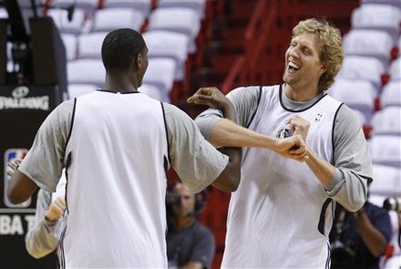 Dallas Mavericks' Ian Mahinmi, Left, And Dirk Nowitzki Chat As