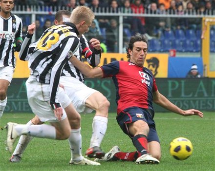 Juventus' Frederik Sorensen, Of Denmark, Left, And Genoa's Luca Toni Fight For The Ball