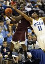 UCLA's Lazeric Jones (11) tries to steal the ball from Montana's Will Cherry (5) during the second half of an NCAA college basketball game in Los Angeles, Sunday, Dec. 5, 2010. Montana won 66 to 57.