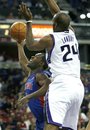 Detroit Pistons guard Rodney Stuckey , left, drives to the basket against Sacramento Kings defender Carl Landry during the first half of an NBA basketball game in Sacramento, Calif., Sunday, Nov. 14, 2010.