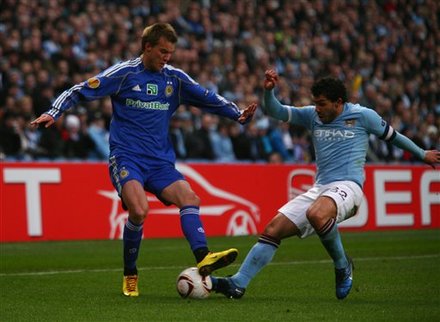 Manchester City's Carlos Tevez, Right, Fights