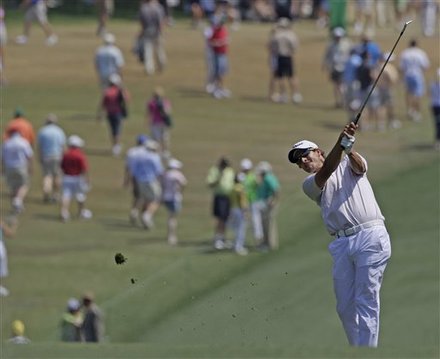 Adam Scott of Australia hits a shot on the first hole during the final round of the Masters golf tournament Sunday, April 10, 2011, in Augusta, Ga.