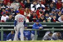 Chicago Cubs ' Carlos Pena (22) walks back to the dugout after grounding out against the Boston Red Sox in the ninth inning of an interleague baseball game at Fenway Park in Boston Friday, May 20,  2011. The Red Sox won 15-5.
