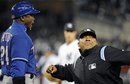 First base umpire Adrian Johnson, right, ejects Texas Rangers first base coach Gary Pettis from the game for arguing a call during the sixth inning of a baseball game against the New York Yankees Sunday, April 17, 2011 at Yankee Stadium in New York. The Yankees won 6-5.