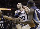 San Antonio Spurs ' Manu Ginobili (20), of Argentina, is fouled by Memphis Grizzlies ' Mike Conley (11) during the fourth quarter of Game 5 of a first-round NBA basketball playoff series, Wednesday, April 27, 2011, in San Antonio. Memphis Grizzlies' Zach Randolph is at right,