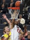 Virginia forward Mike Scott (23) shoots in front of Michigan forward Evan Smotrycz (23) during an NCAA college basketball game Tuesday, Nov. 29, 2011, in Charlottesville, Va. Virginia won 70-58.