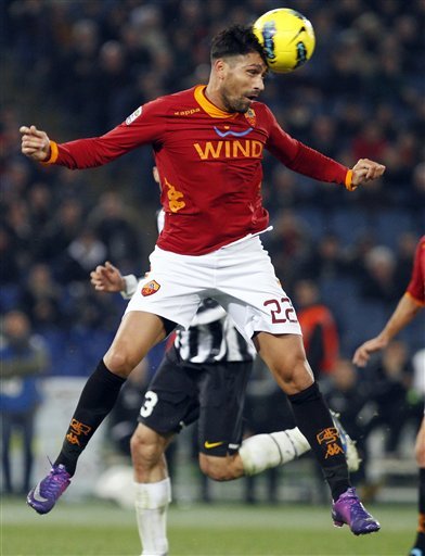 AS Roma's Marco Borriello Jumps