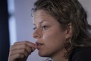 FILE - This June 14, 2011, file photo shows Kim Clijsters of Belgium answering questions during a news conference after losing her match against Romina Oprandi of Italy at the women's singles Unicef  Open tennis tournament in Rosmalen, central Netherlands. The two-time defending U.S. Open champion will not go for three in a row this year because of a stomach muscle injury.