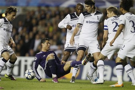 Real Madrid's Cristiano Ronaldo, Second Left, Is Surrounded By Tottenham Hotspur's, From Right, Benoit Assou-Ekotto,